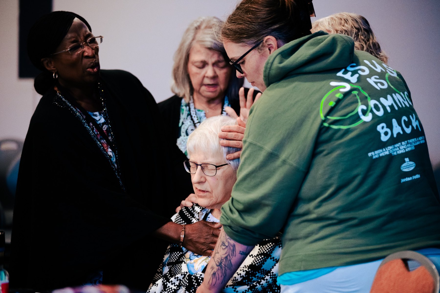 SoKM ministry team praying